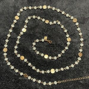 BANANA REPUBLIC Necklace. 
Gold plated coin & Fancy Cut Beads (milky green).